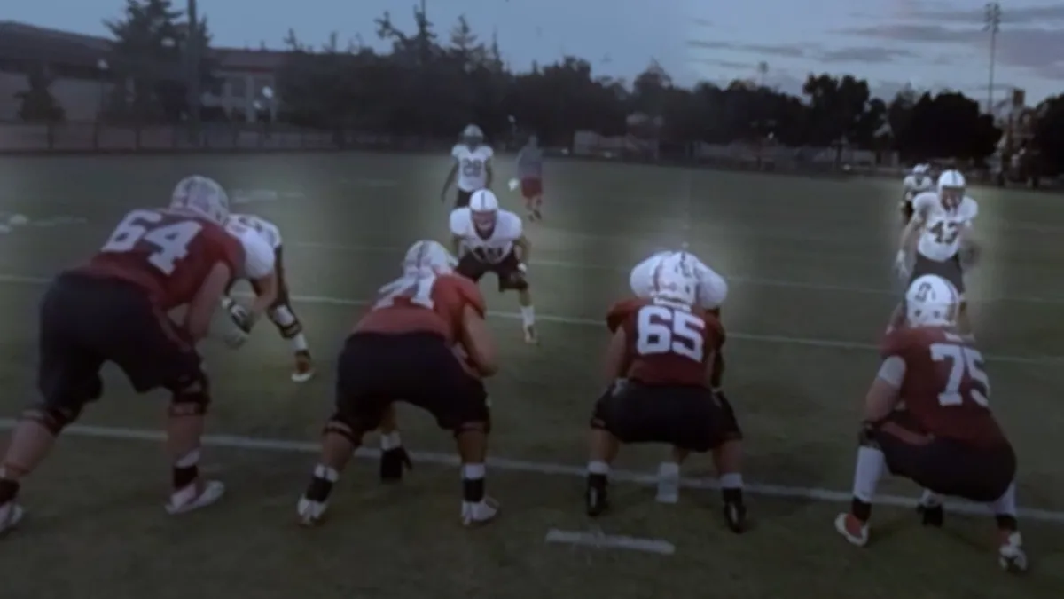 Football scene, reading the defense from the quarterback position